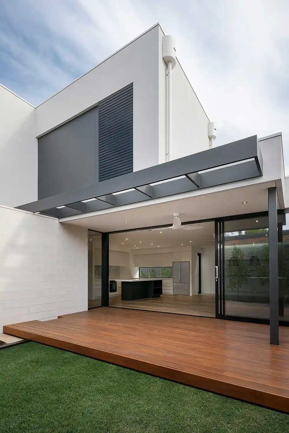 Modern home with open indoor-outdoor living and wood deck