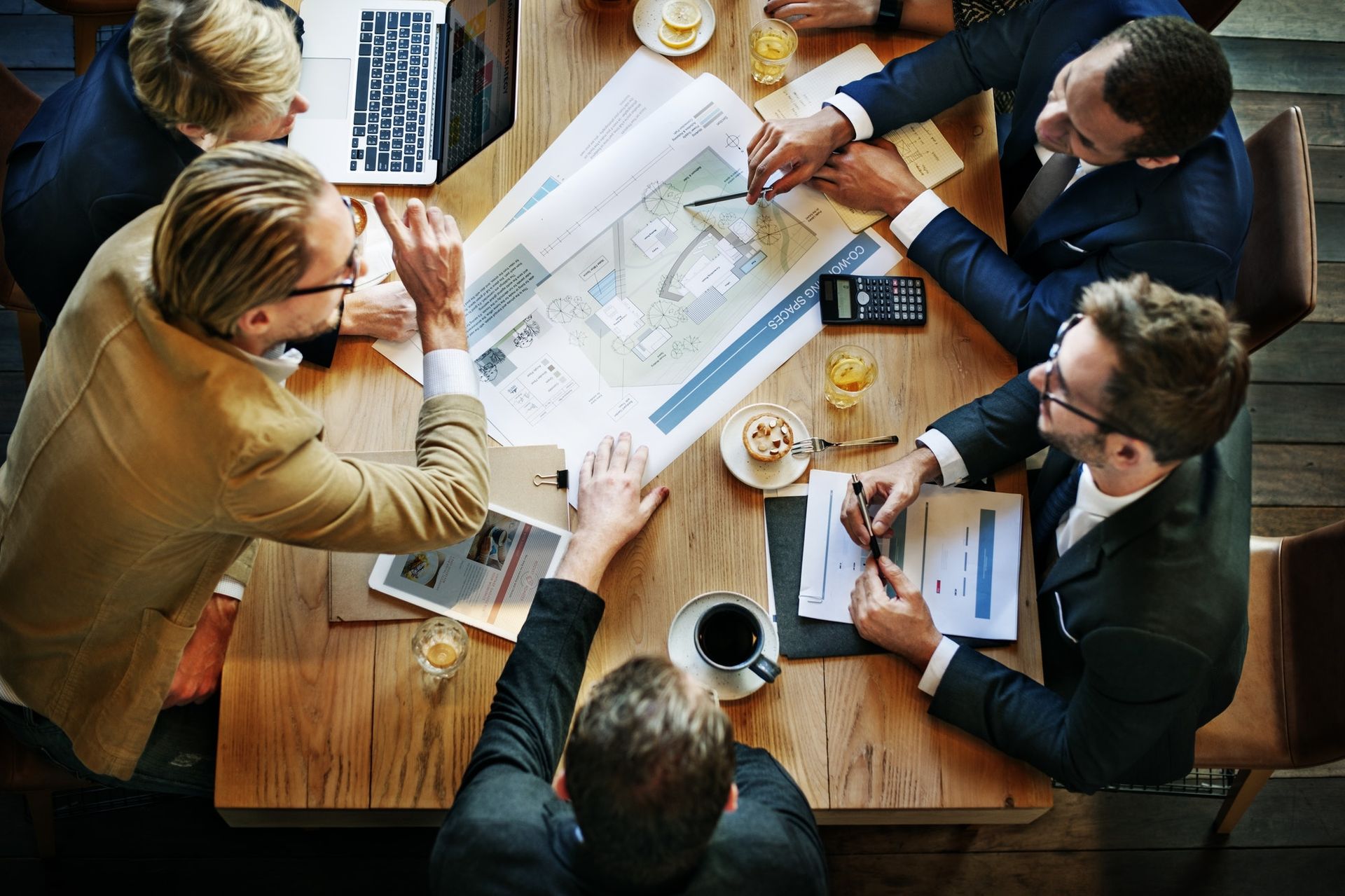 The Everluck Realty team planning around a table
