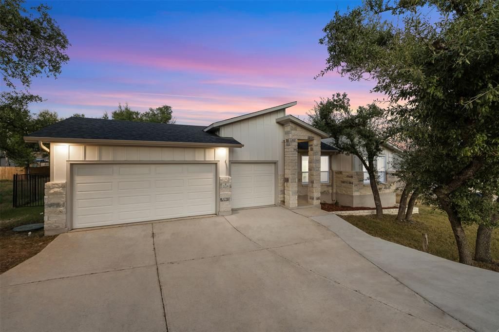21208 Santa Rosa Ave, Lago Vista — modern lakeside home at dusk